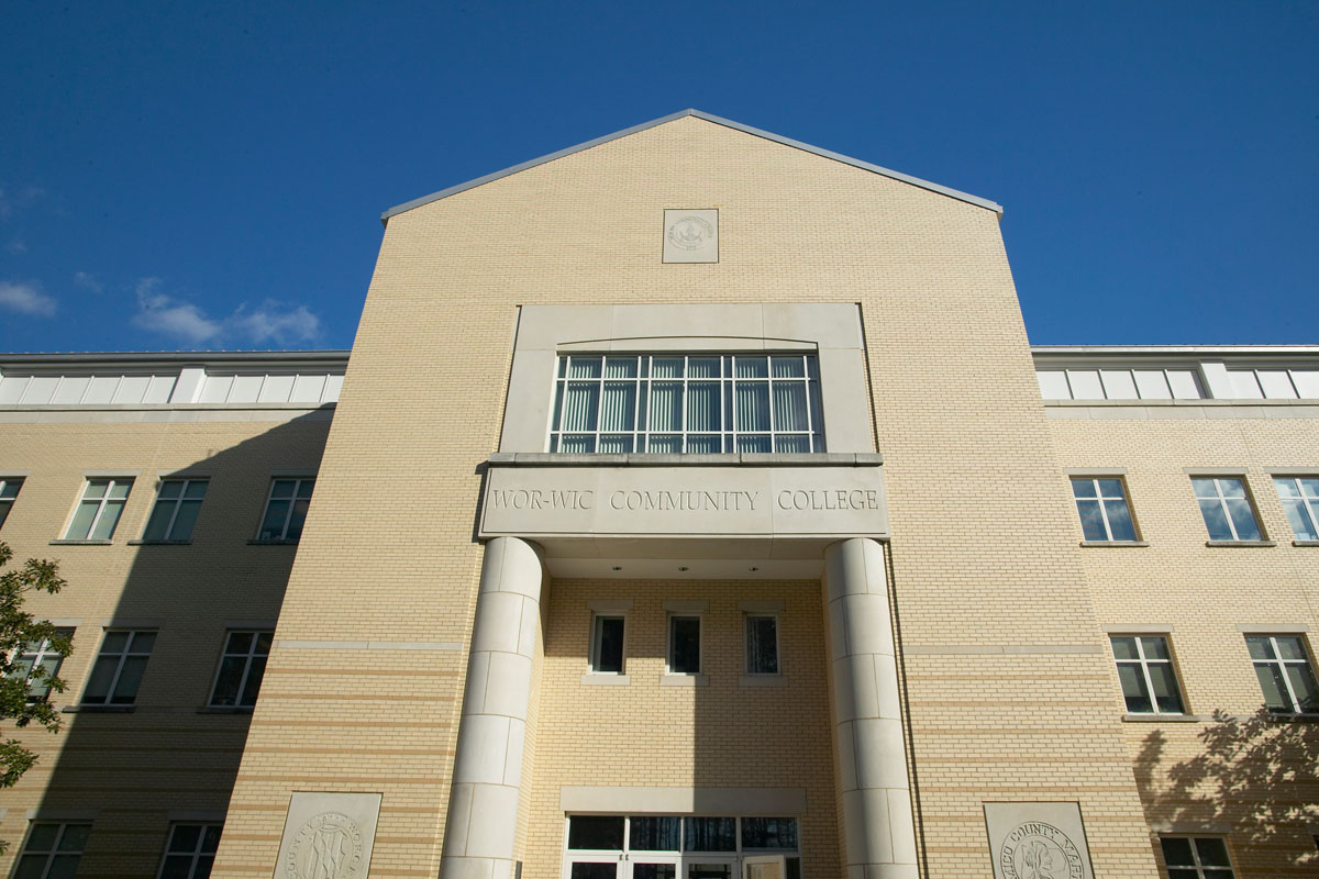 the front of a building with columns and windows